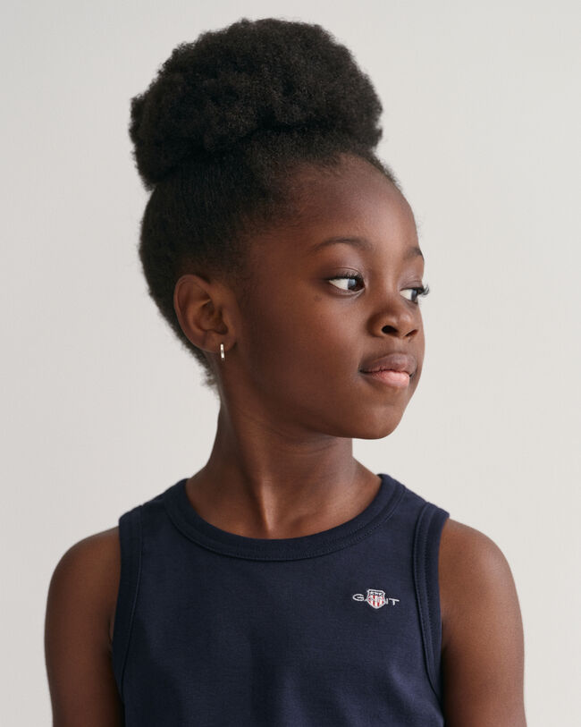 Kids linne med sk&ouml;ldemblem