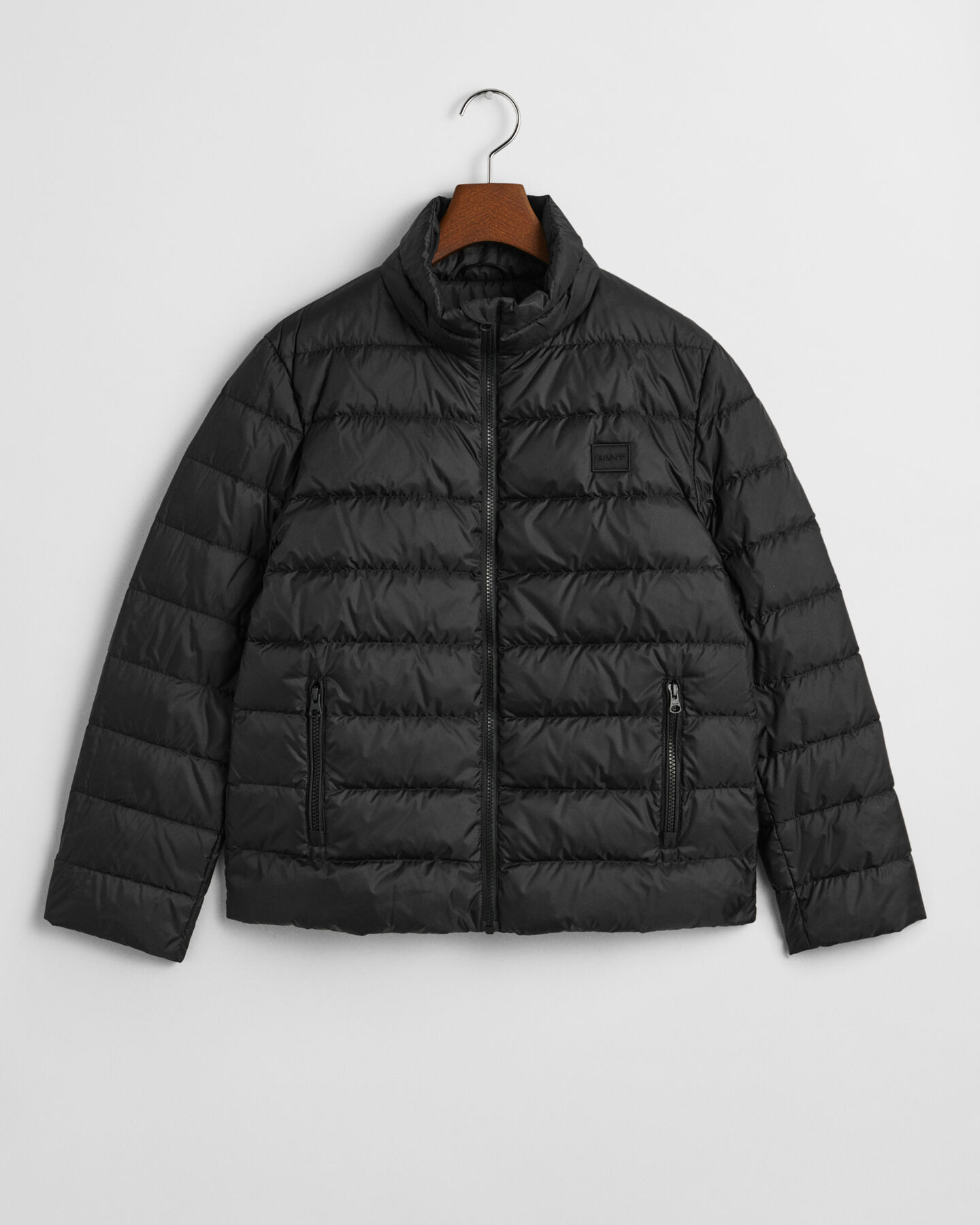 Tunn dunjacka med logotyp