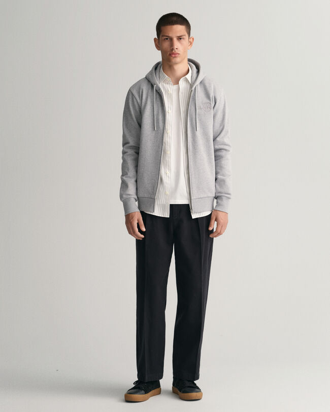 Hoodie med dragkedja och en sköld ton i ton