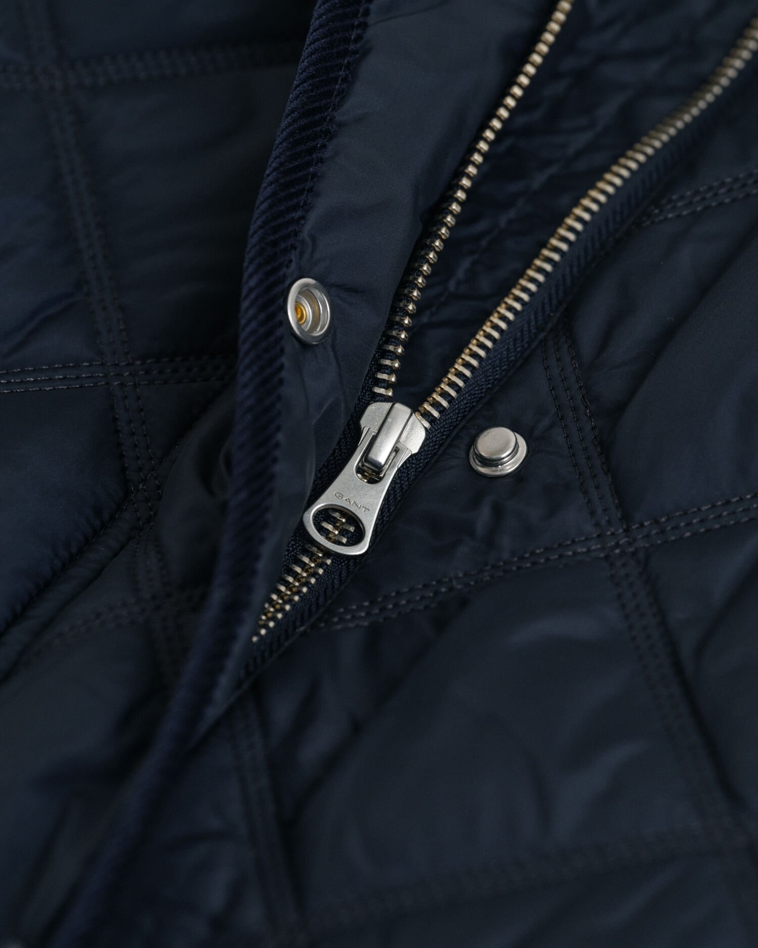 Quiltad kappa med manchesterdetaljer