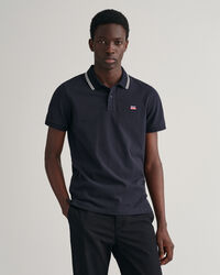 Randig pik&eacute;tr&ouml;ja med kontrasterande krage