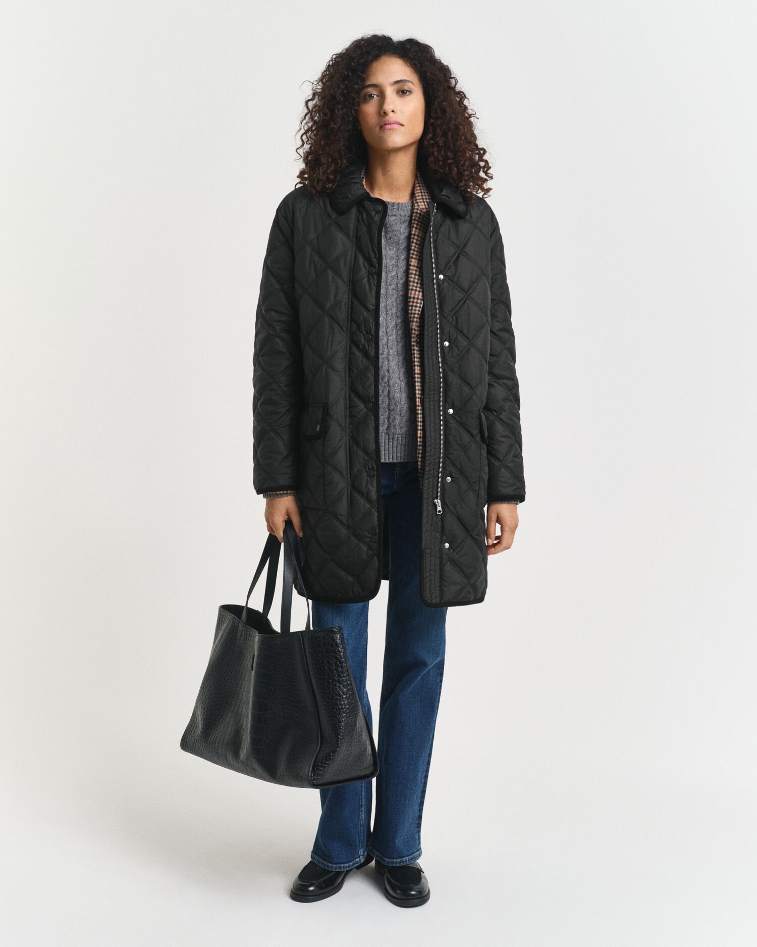 Quiltad kappa med manchesterdetaljer