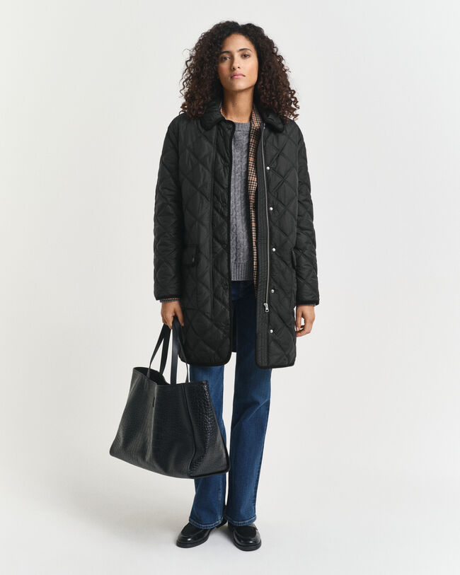 Quiltad kappa med manchesterdetaljer