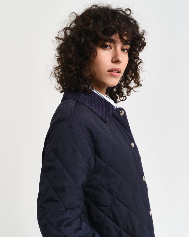 Quiltad kappa med manchesterdetaljer