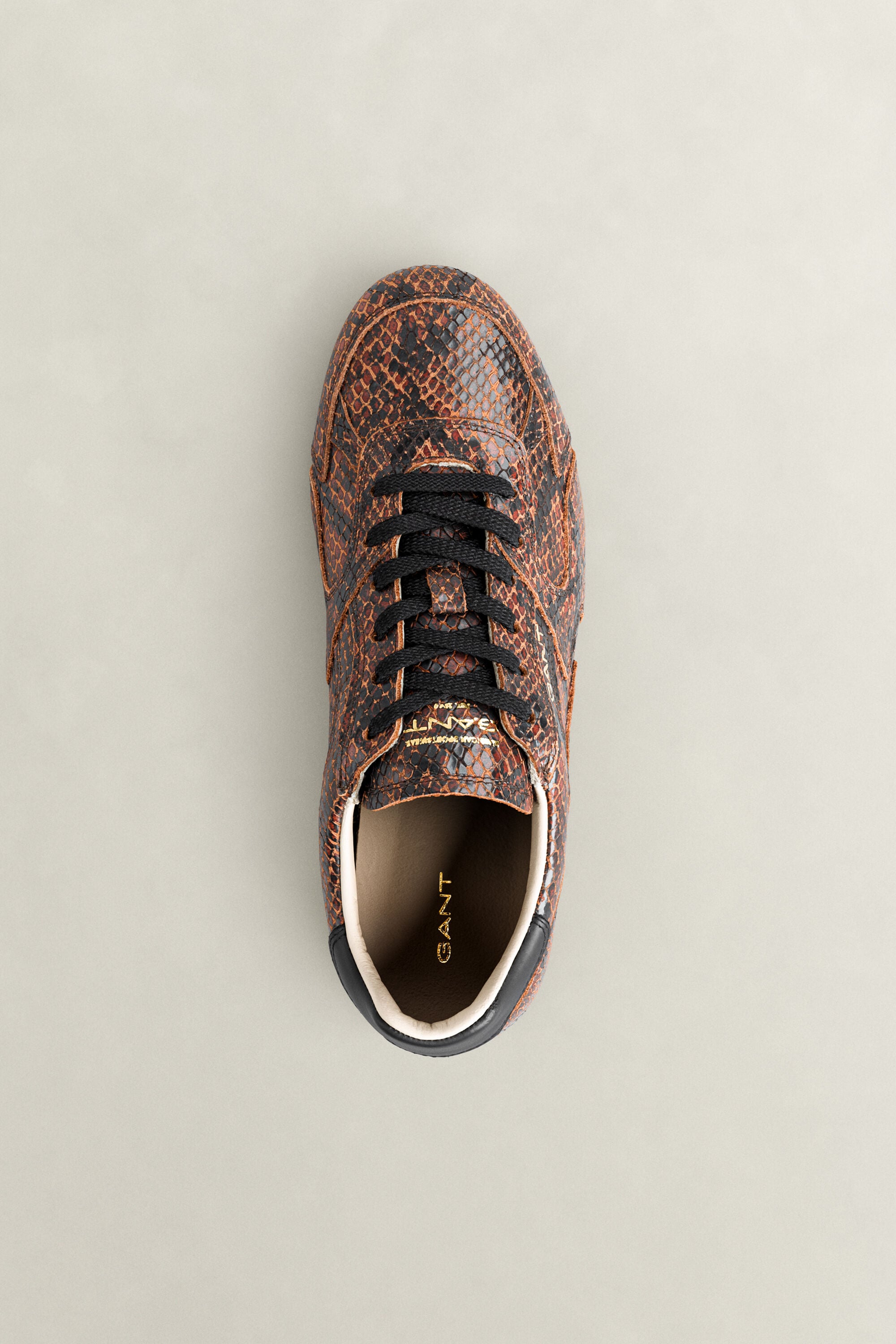 Sperly lädersneakers med ormskinnseffekt