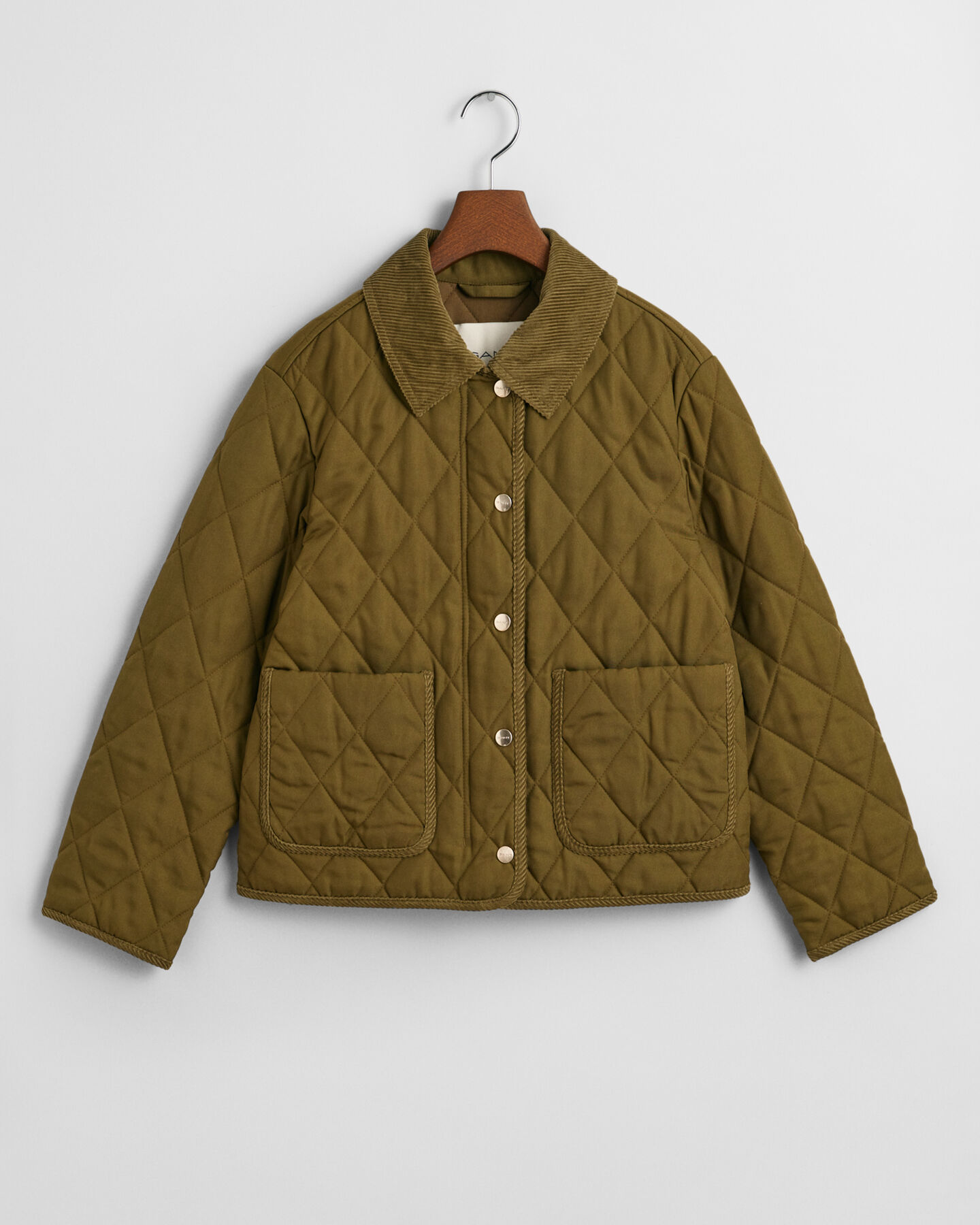 Quiltad jacka med manchesterdetaljer