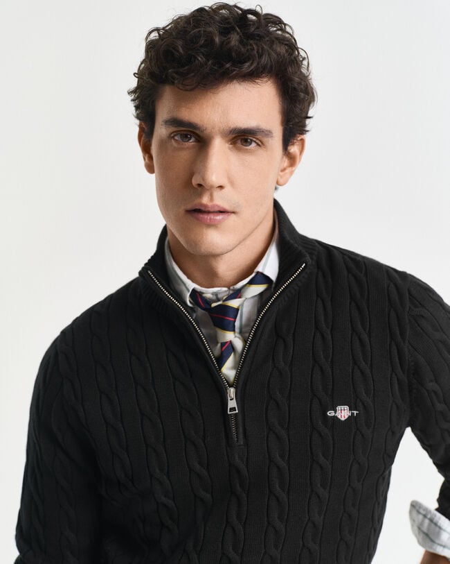 Kabelstickad bomullströja med dragkedja vid halsöppningen