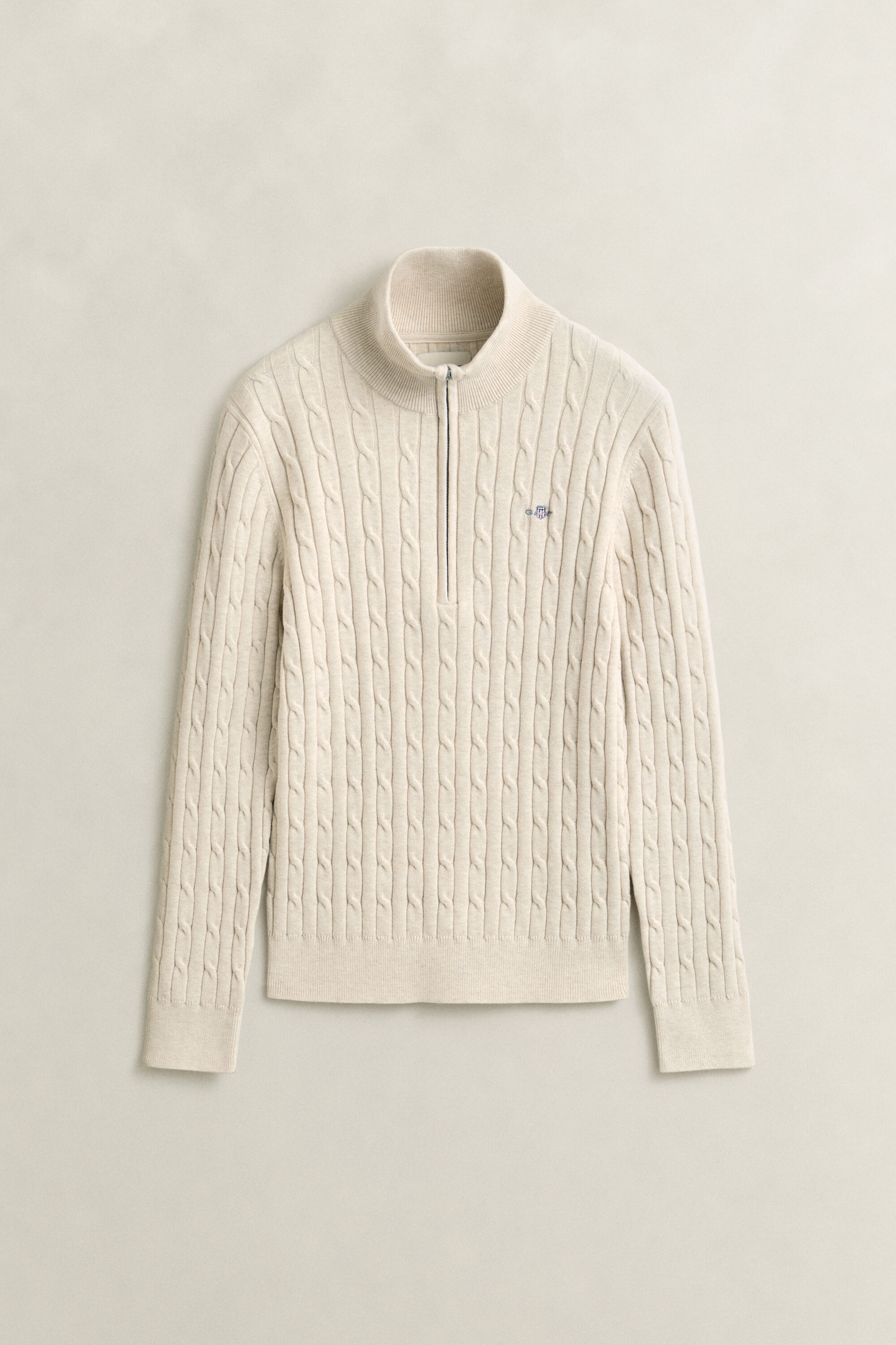 Kabelstickad tröja i bomullsstrech med half-zip