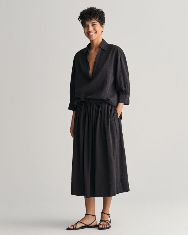 Randig dra-på-kjol i bäckebölja