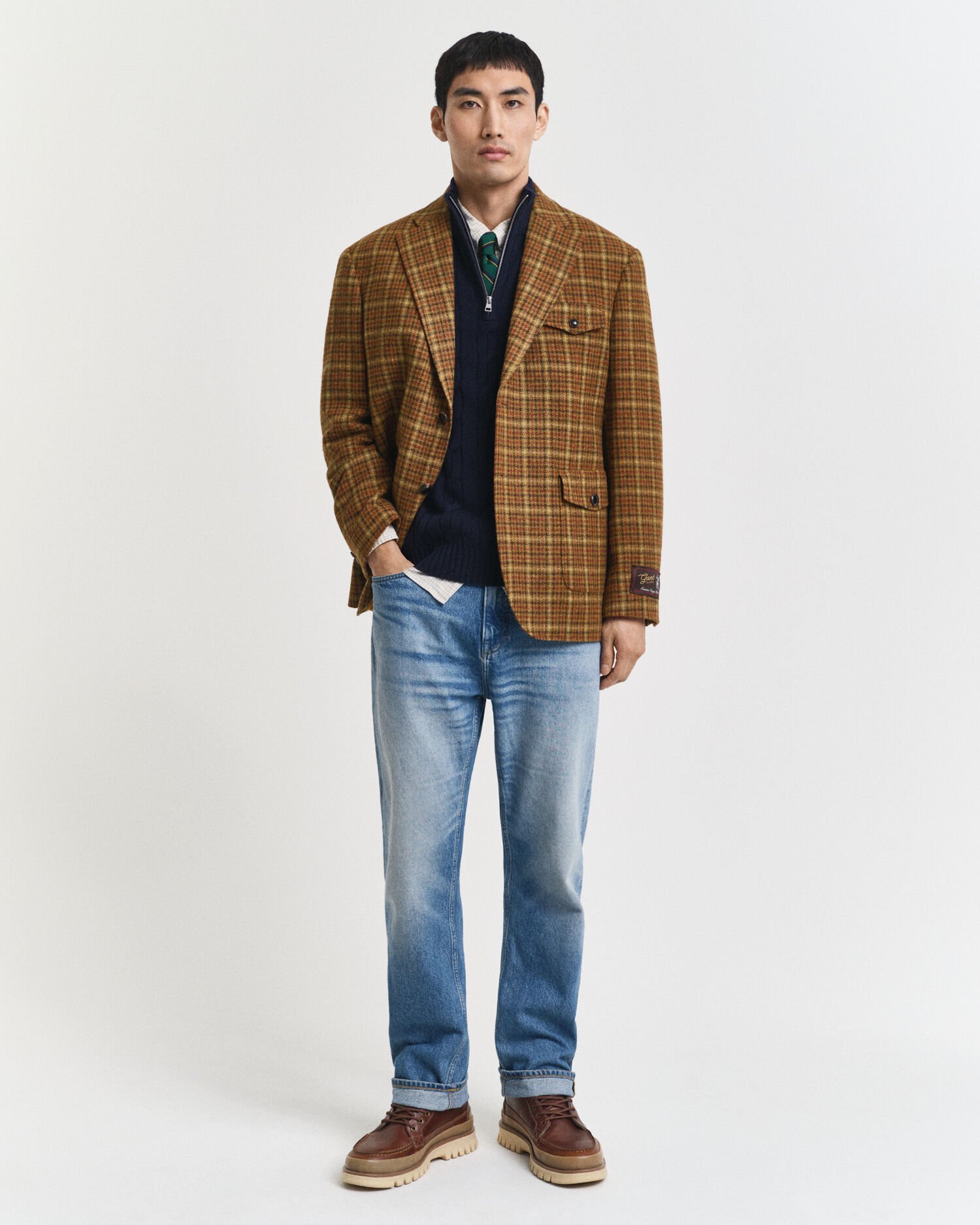 Kabelstickad tröja i lammull med half-zip