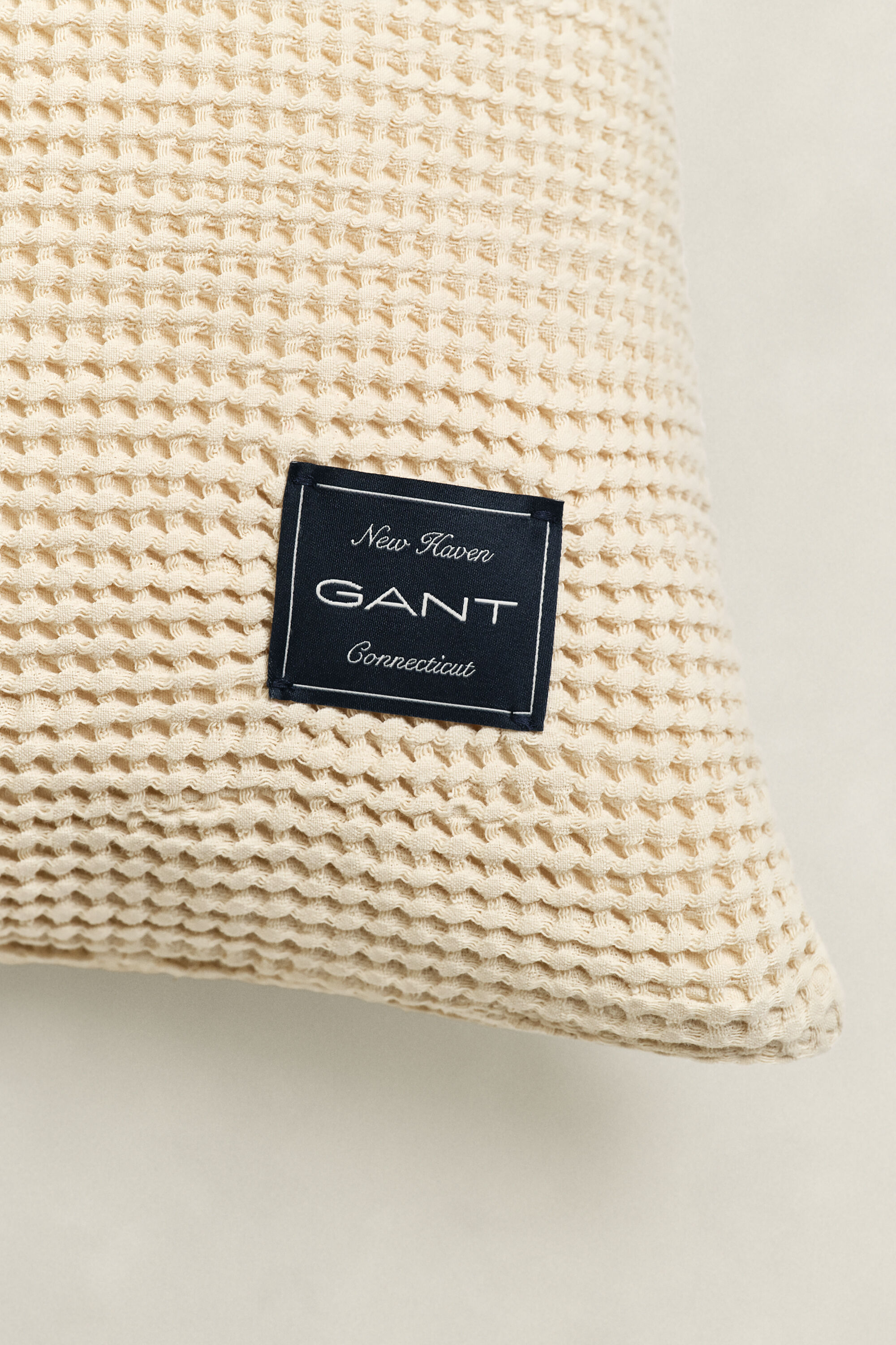 Kuddfodral i bomull med våffelstruktur