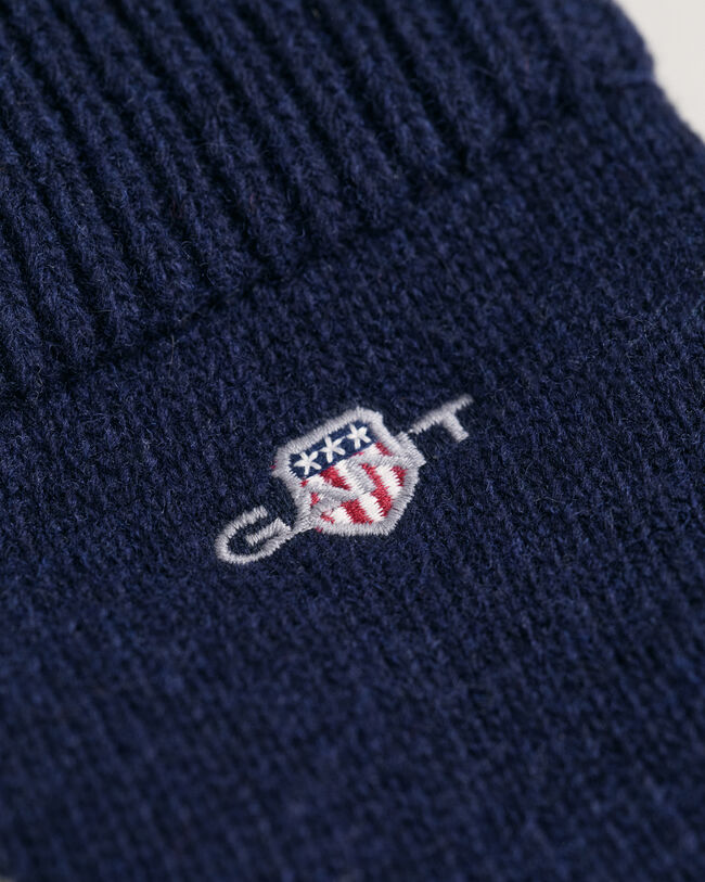 Fingervantar i ull med sköld