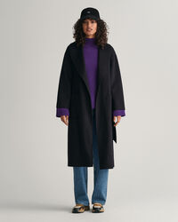 Ribbstickad ylletröja med ståkrage