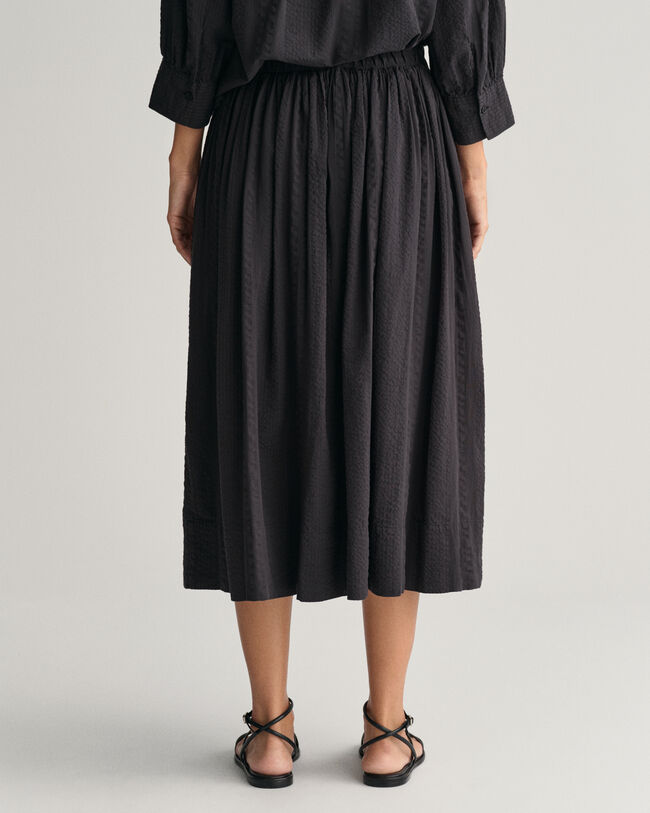 Randig dra-på-kjol i bäckebölja