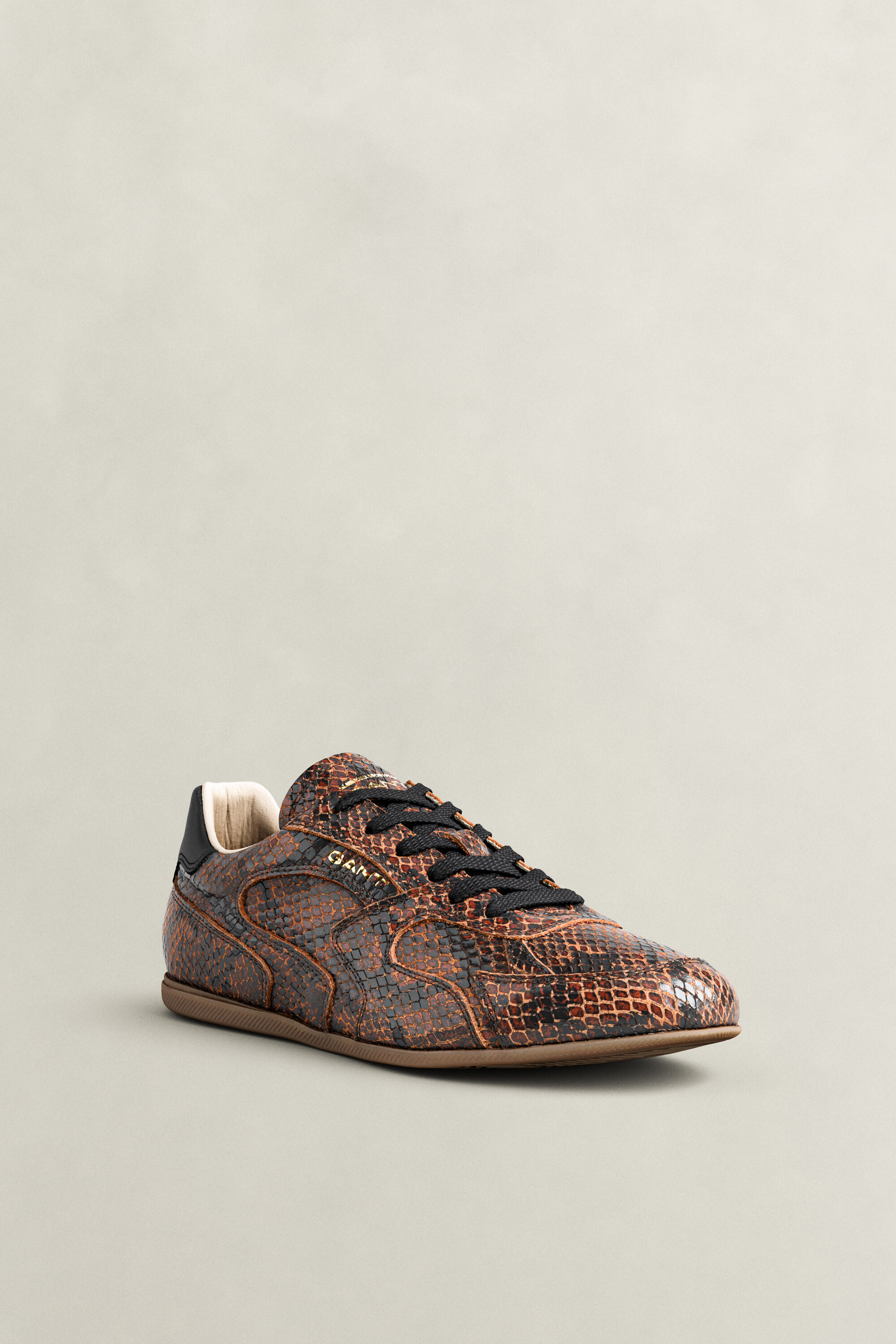Sperly lädersneakers med ormskinnseffekt