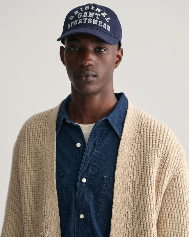 Cardigan i ribbstickad bouclé