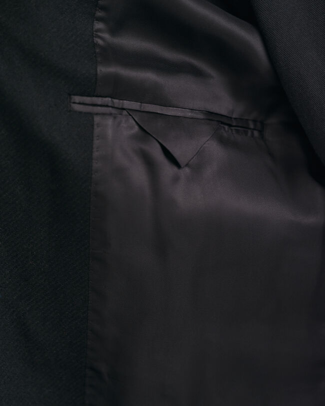 Klassisk figursydd ytterrock i ull