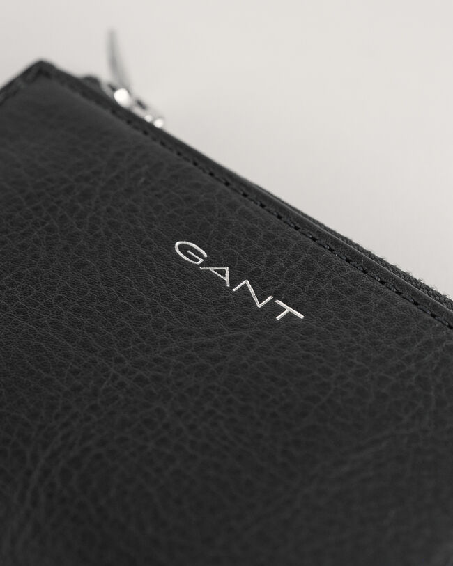 Skinnfodral med dragkedja