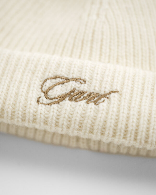 Baby tofsmössa med öronlappar