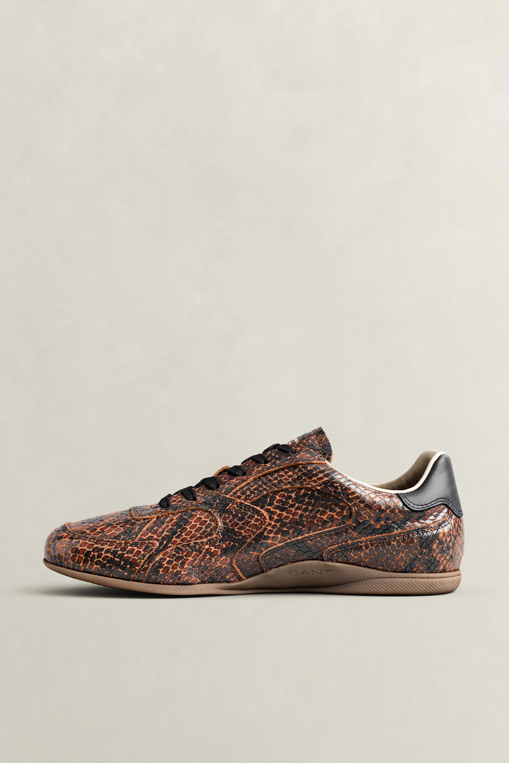 Sperly lädersneakers med ormskinnseffekt