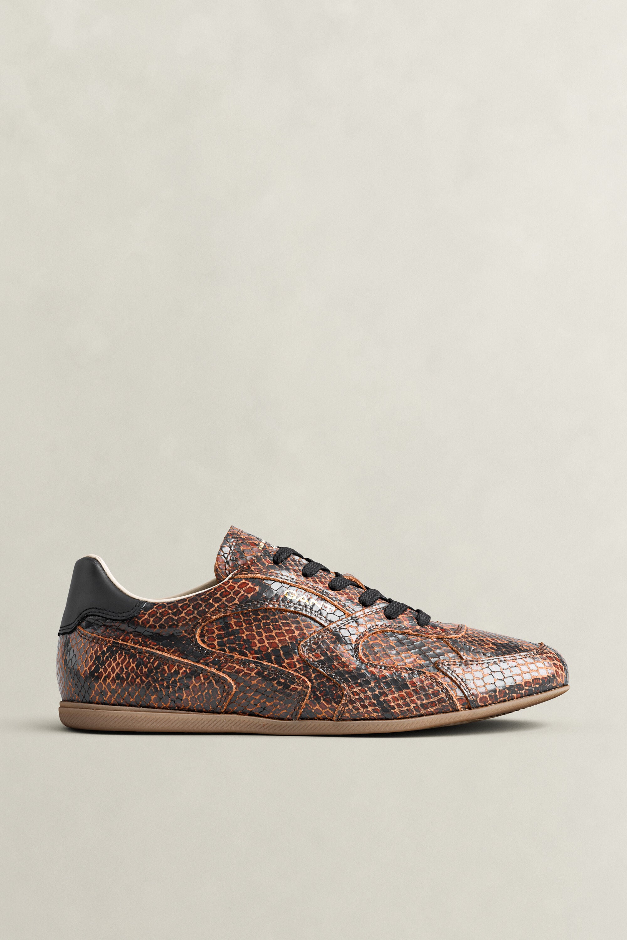 Sperly lädersneakers med ormskinnseffekt
