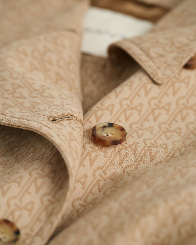 Trenchcoat i jacquard med monogram