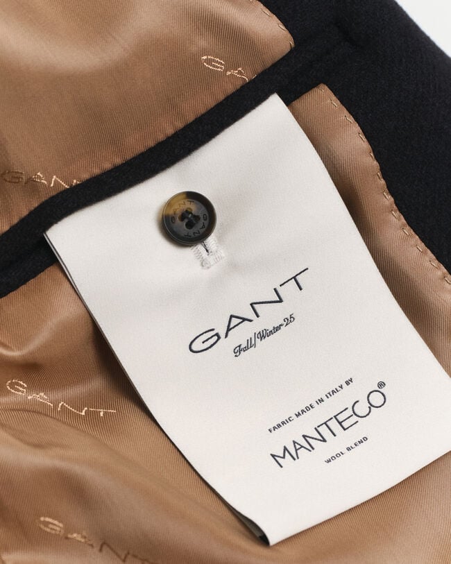 Medellång skepparkavaj i ylle