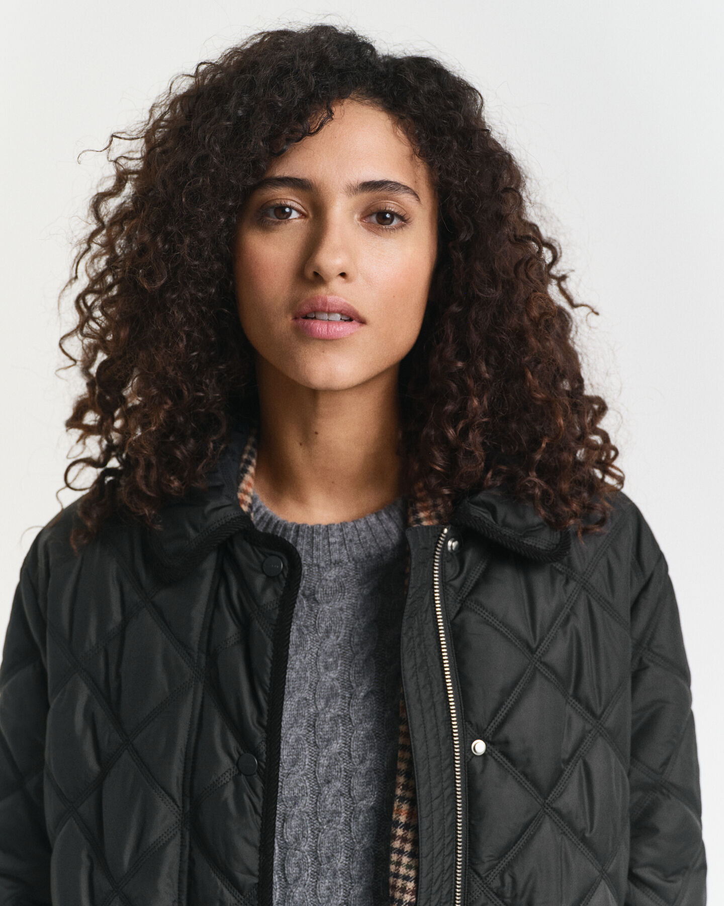 Quiltad kappa med manchesterdetaljer