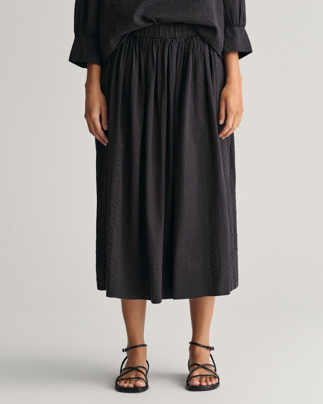 Randig dra-på-kjol i bäckebölja