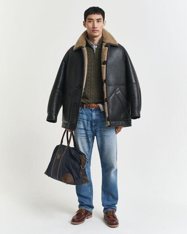 Kabelstickad bomullströja med dragkedja vid halsöppningen