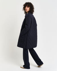 Quiltad kappa med manchesterdetaljer