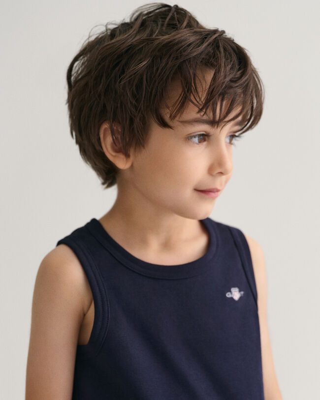 Kids linne med sk&ouml;ldemblem