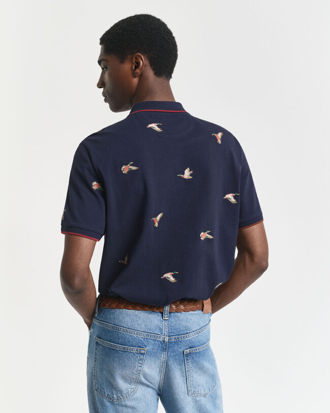 Broderad pikétröja