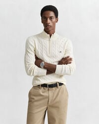 Kabelstickad bomullströja med dragkedja vid halsöppningen