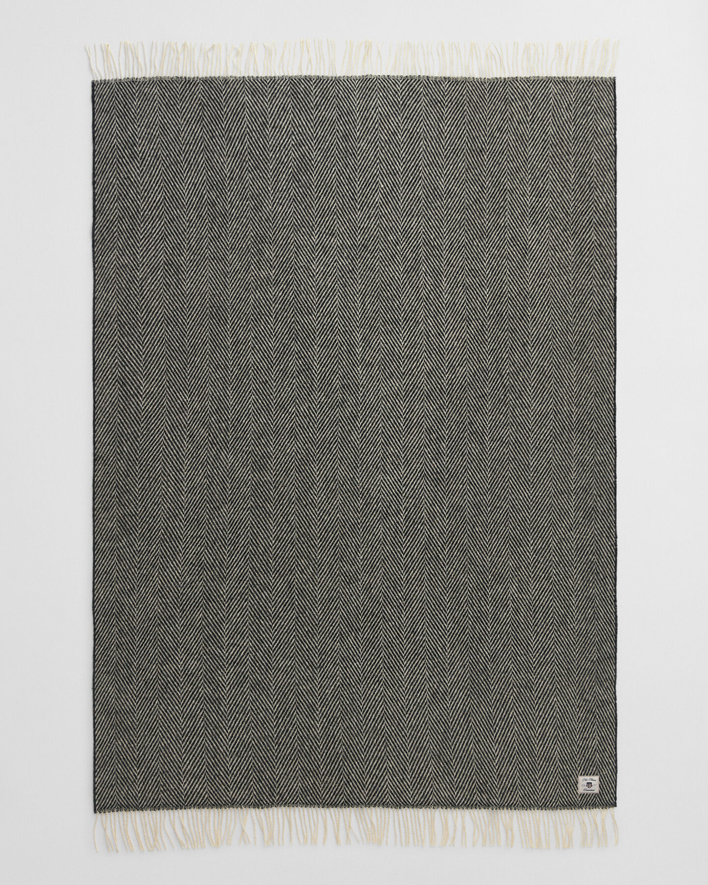 Fiskbensmönstrad yllepläd