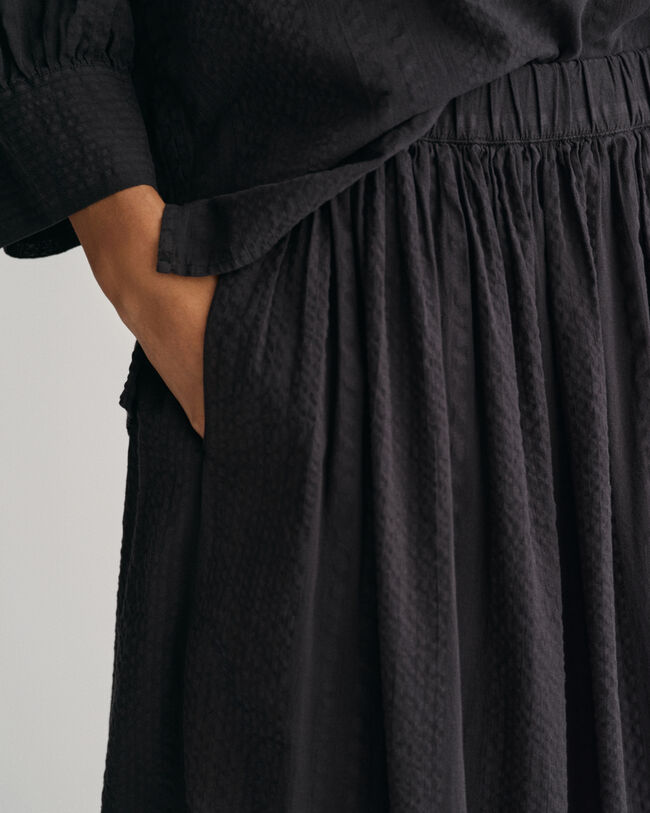 Randig dra-på-kjol i bäckebölja