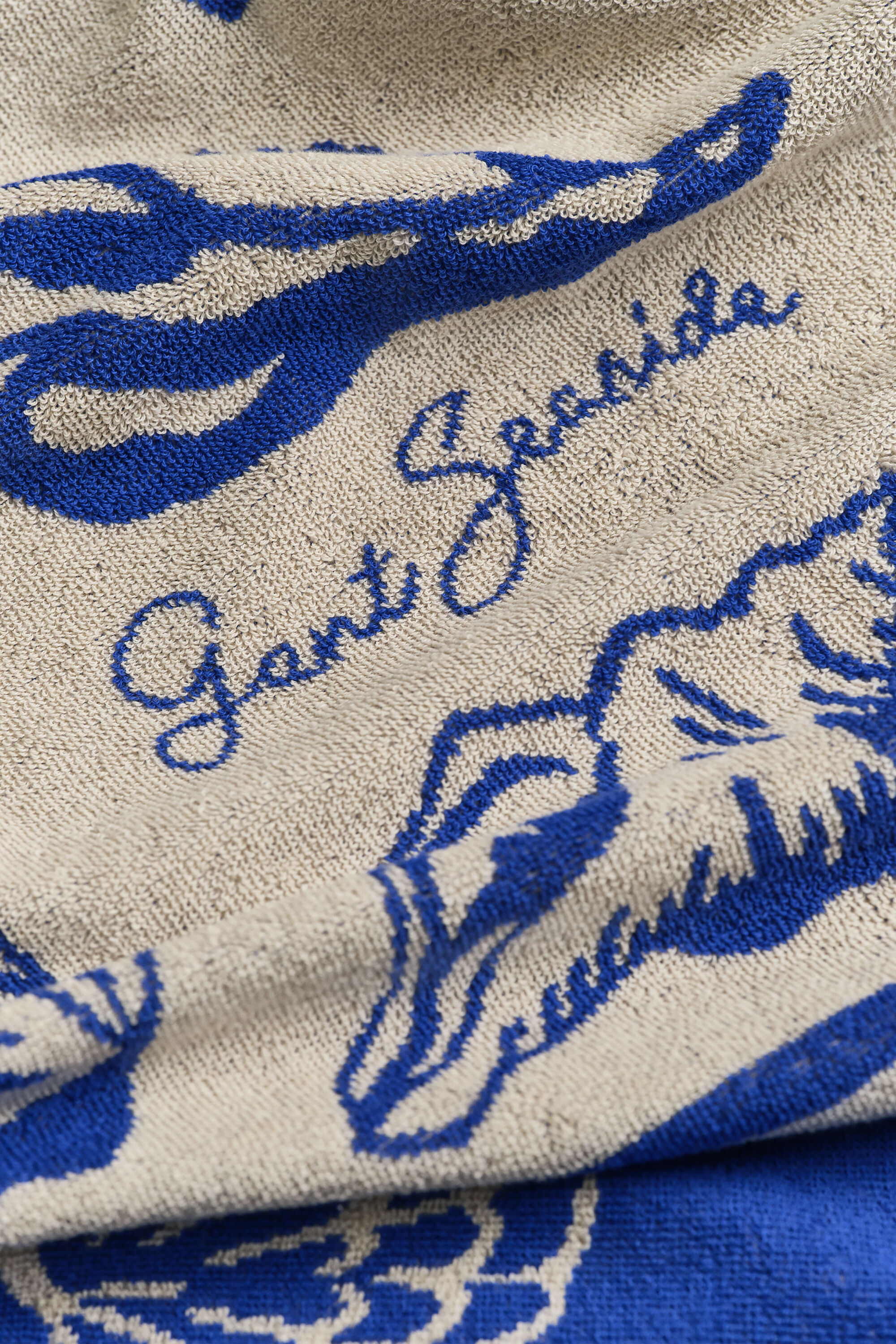 Snäckmönstrad strandhandduk