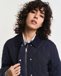 Quiltad kappa med manchesterdetaljer