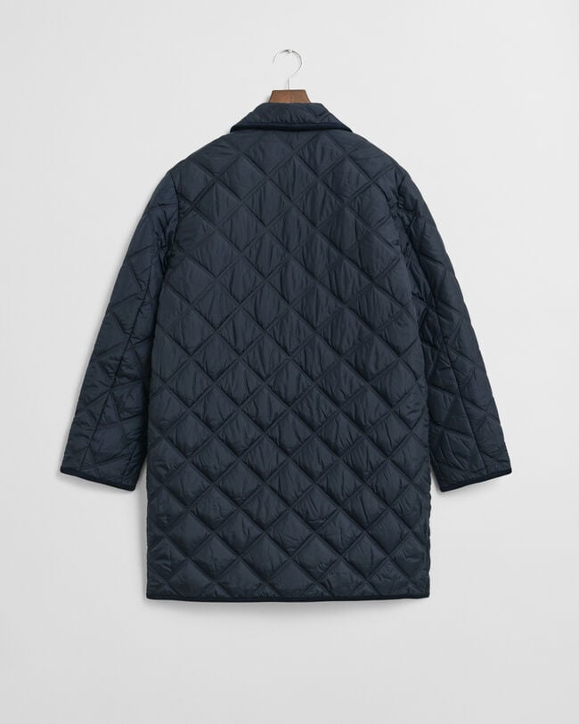 Quiltad kappa med manchesterdetaljer