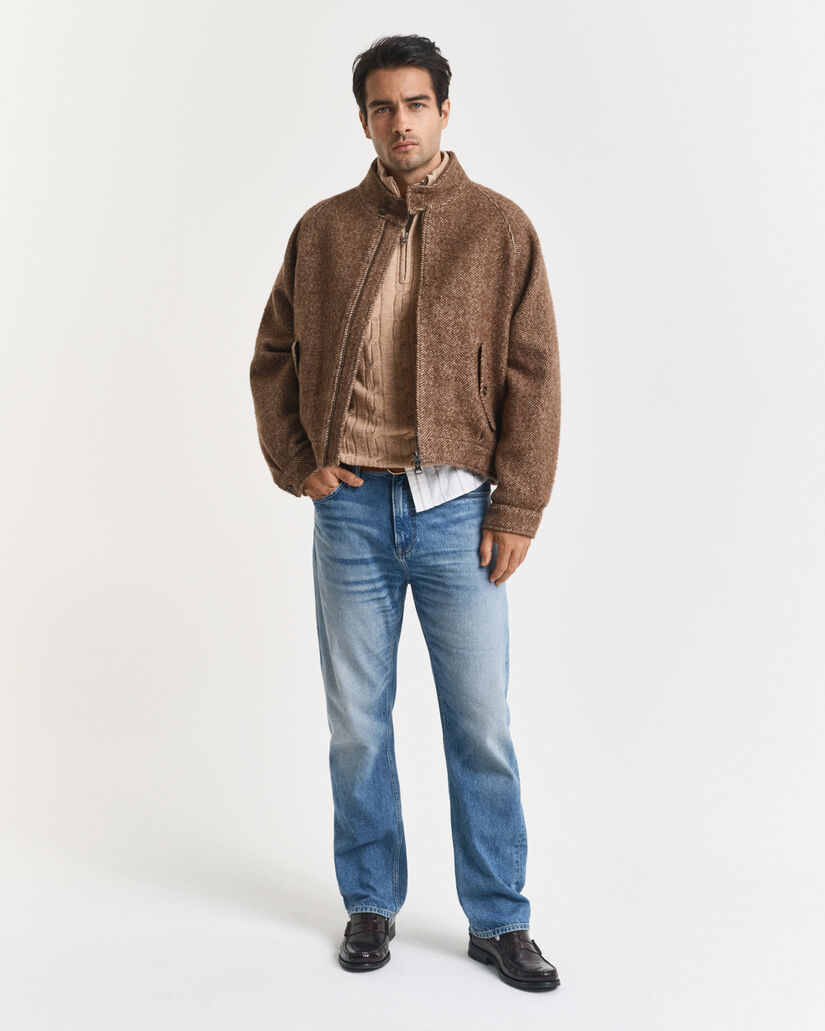 Kabelstickad tröja i lammull med half-zip