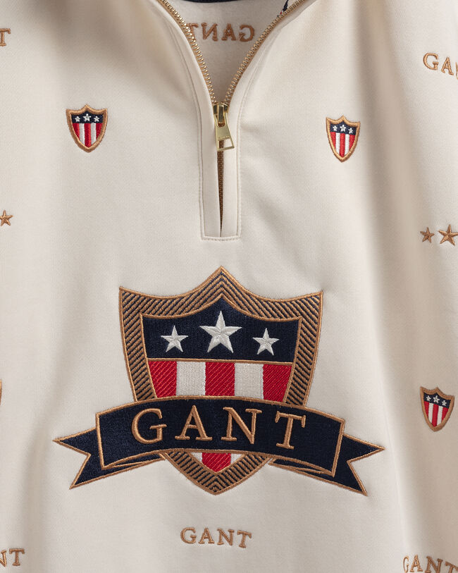 Teens Banner Shield tr&ouml;ja med halvl&aring;ng dragkedja