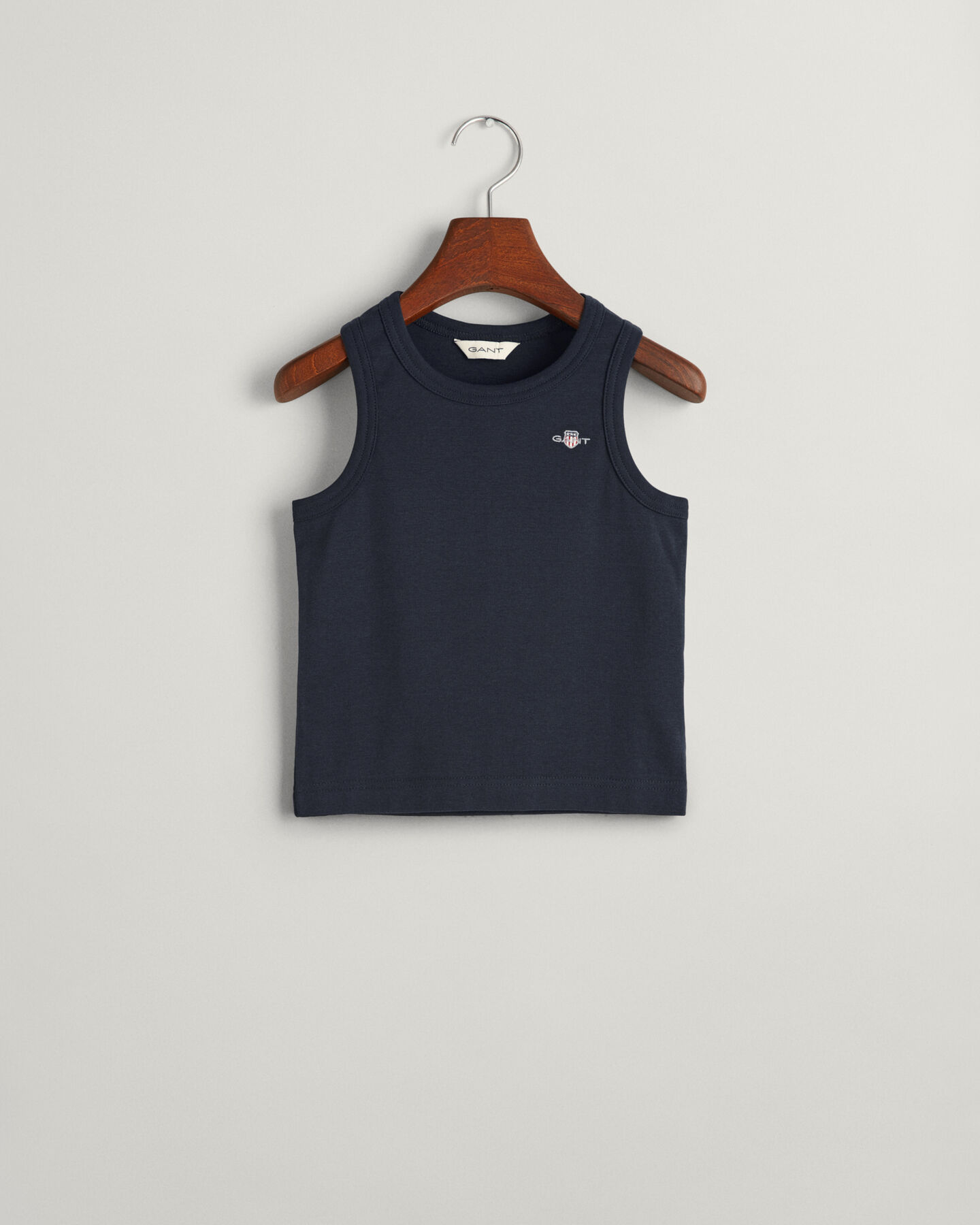 Kids linne med sk&ouml;ldemblem