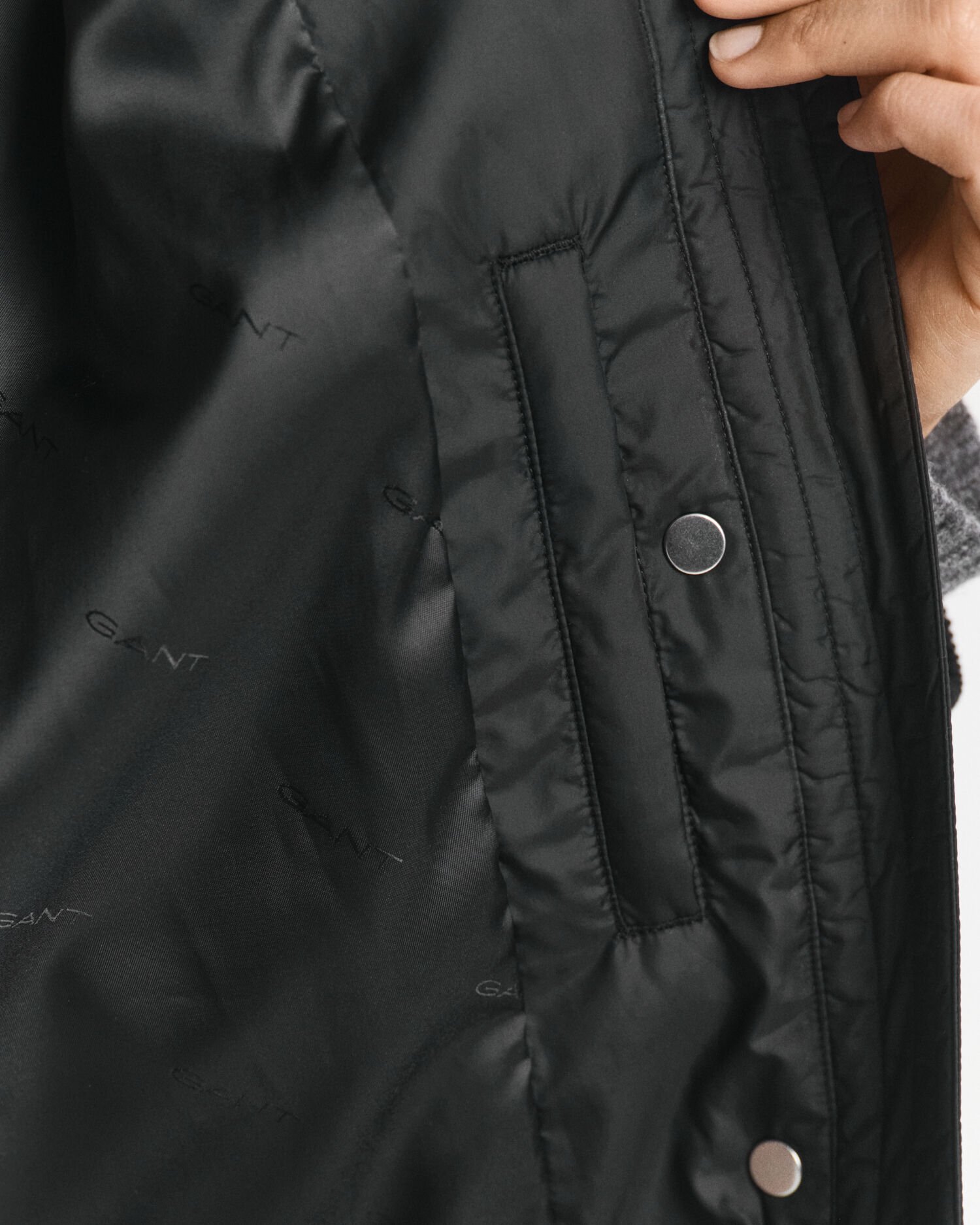 Quiltad kappa med manchesterdetaljer