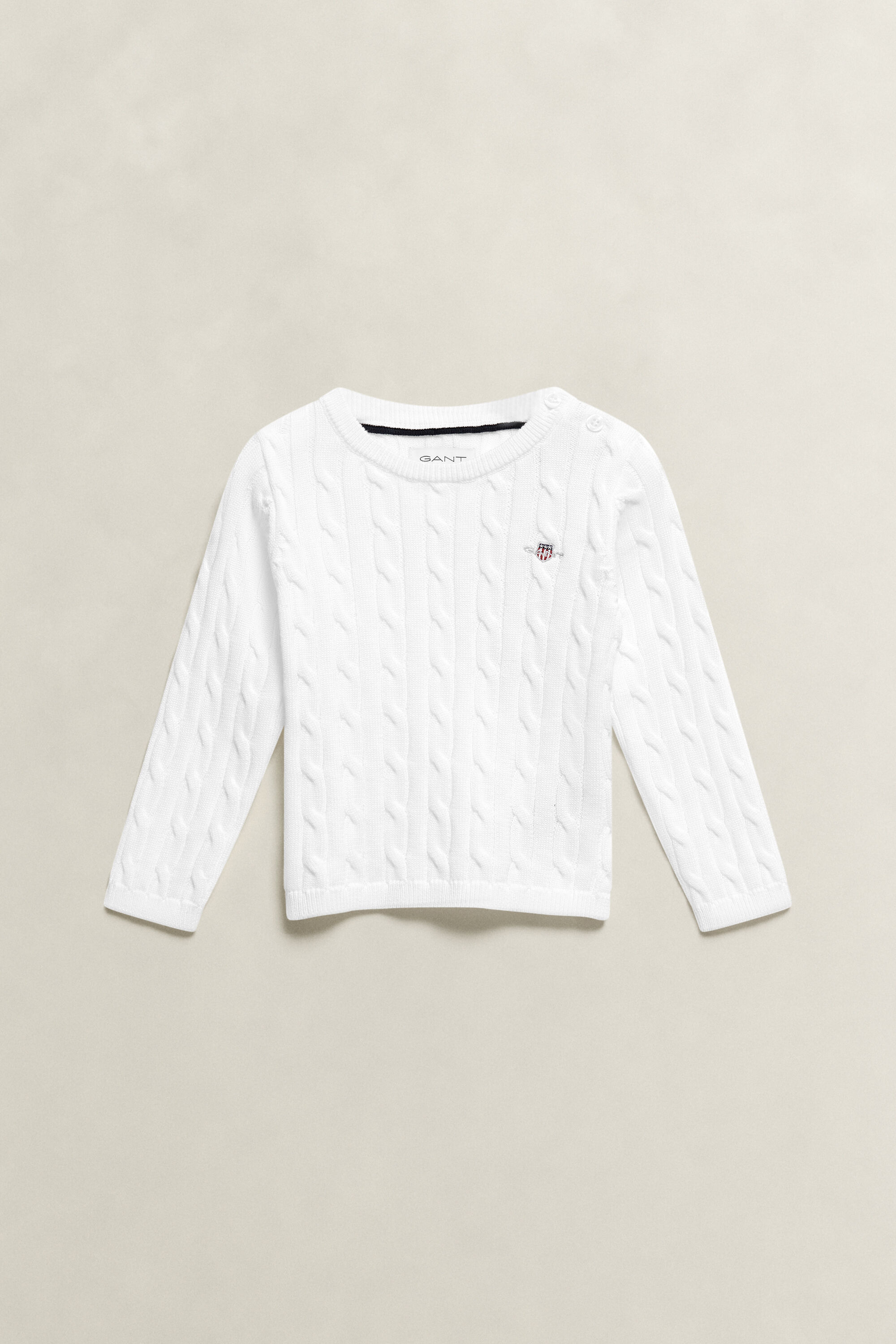 Girls kabelstickad tröja med sköldemblem