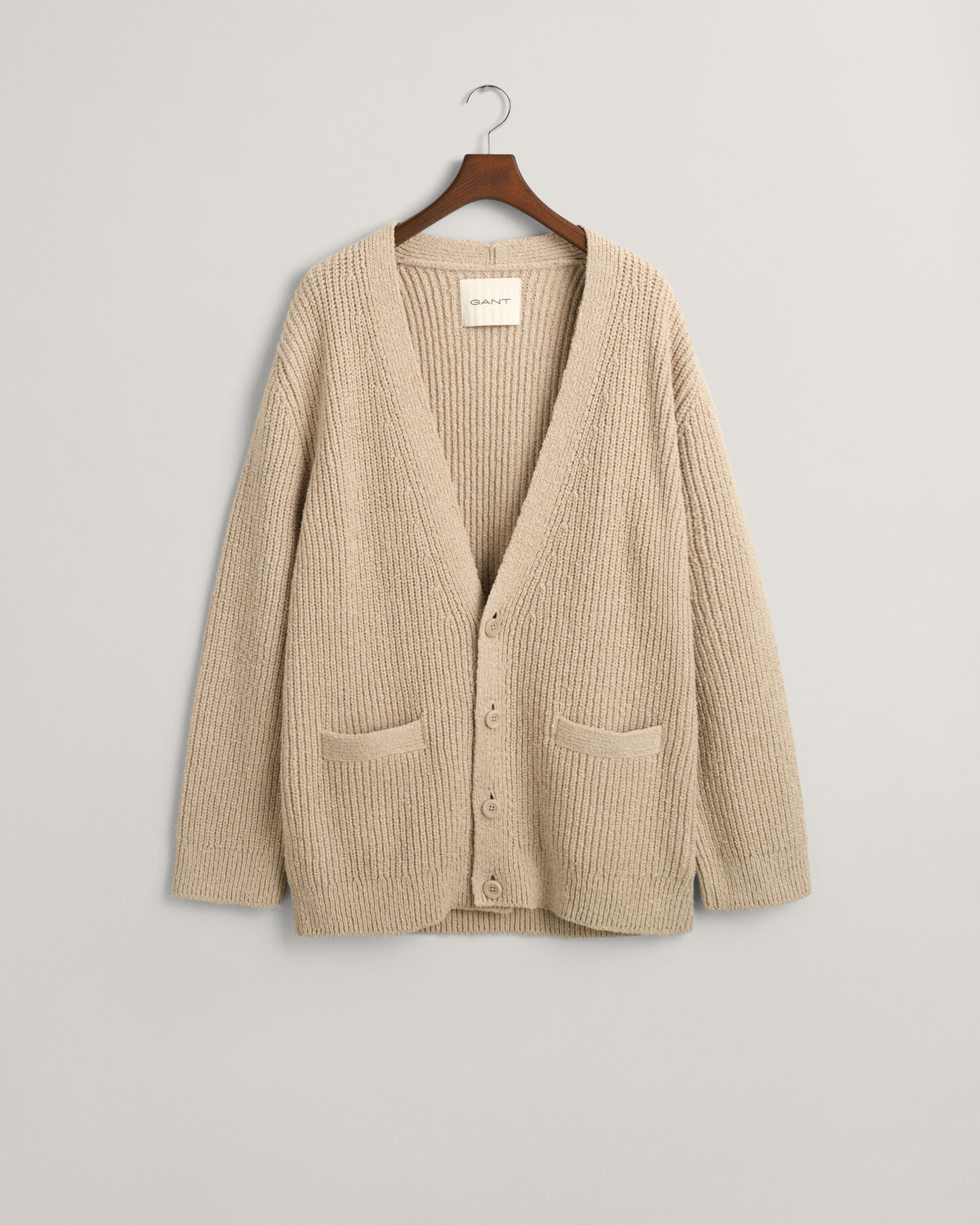 Cardigan i ribbstickad bouclé